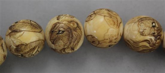 Two Japanese carved ivory necklaces, early 20th century,